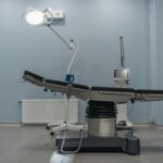 A contemporary operating room showcasing state-of-the-art medical equipment and surgical table.